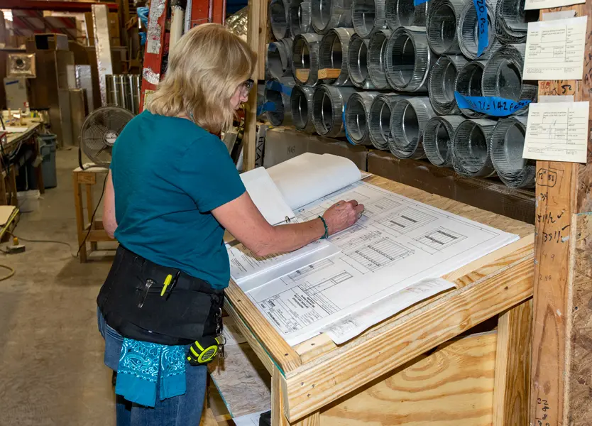 Modular building plans being reviewed and marked up